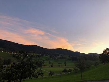 Scenic view of landscape against sky during sunset