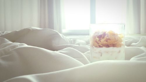 Close-up of bread on bed