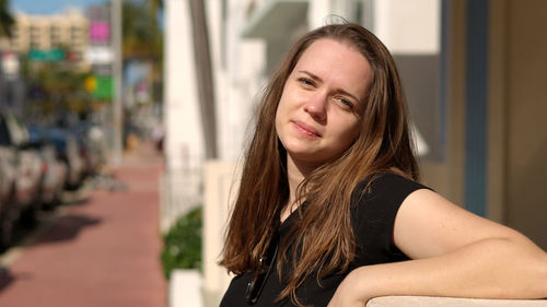 Portrait of young woman looking away