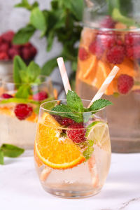 Summer sangria cocktail or lemonade with raspberry, orange and mint. organic detox healthy drink 