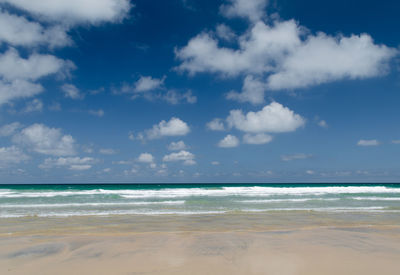 Scenic view of beach against sky