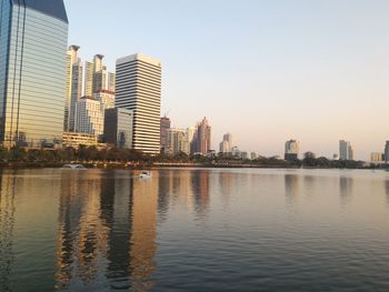 Low angle view of city skyline against clear sky