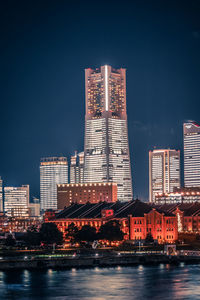 Illuminated buildings in city at night