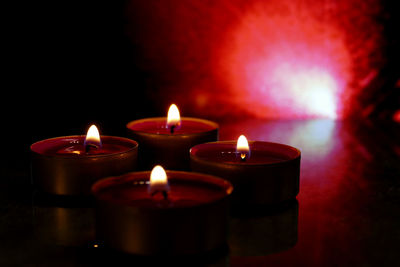 Close-up of lit tea light candles