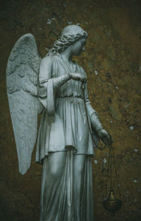 Statue of angel at cemetery