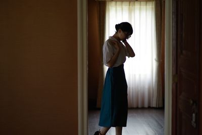 Woman standing at home