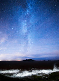 Scenic view of sea against sky at night