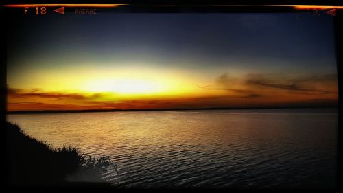 Scenic view of sea at sunset