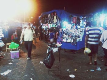 People on street market at night