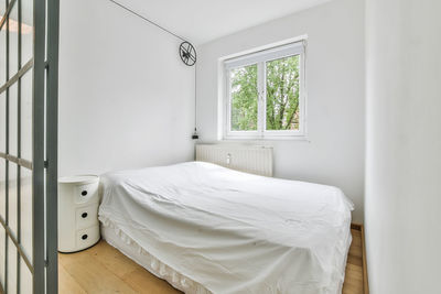 White bed on window at home