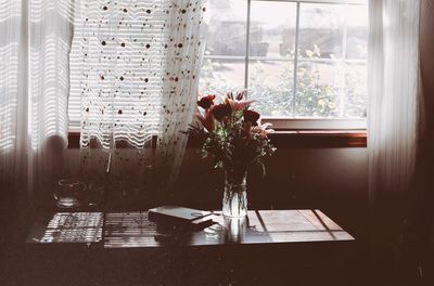 Flower vase on table at home