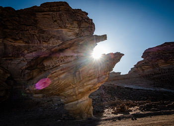 Sun shining through rocks