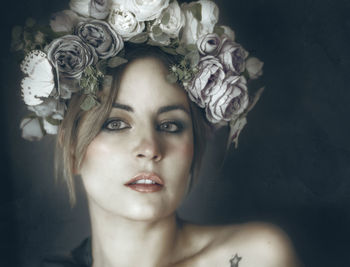 Close-up portrait of young woman wearing mask