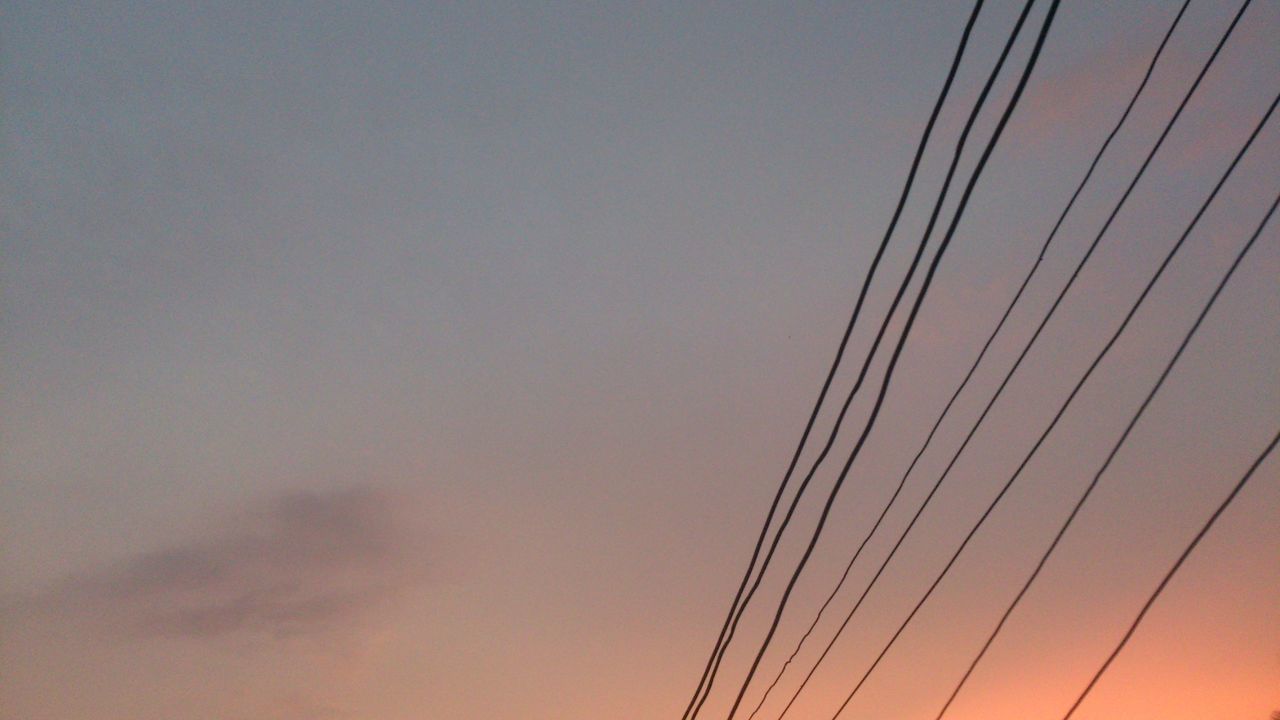 low angle view, power line, connection, electricity pylon, electricity, cable, power supply, clear sky, sky, copy space, technology, sunset, outdoors, no people, fuel and power generation, power cable, silhouette, nature, high section, dusk