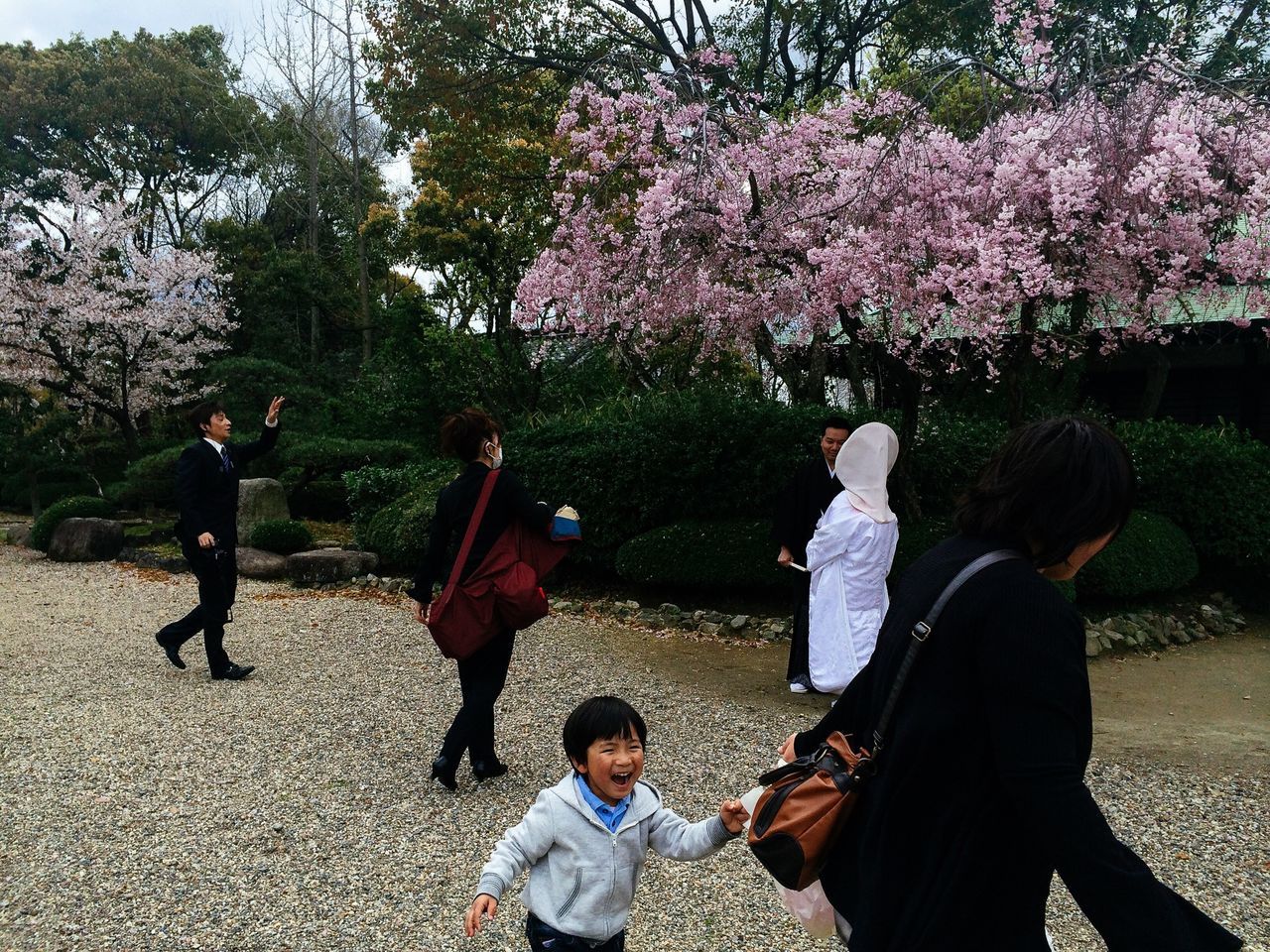 lifestyles, leisure activity, togetherness, casual clothing, bonding, girls, love, childhood, tree, person, boys, friendship, park - man made space, enjoyment, elementary age, full length, family