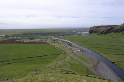 Scenic view of agricultural landscape against sky