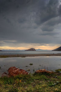 Scenic view of land against sky during sunset