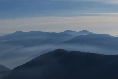 Scenic view of silhouette mountains against sky