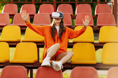 Portrait of woman sitting in stadium