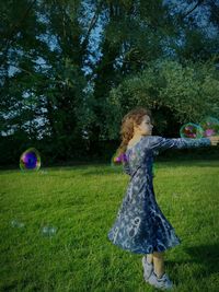 Full length of woman on grassy field