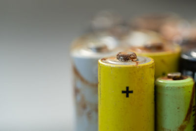 Closeup of used battery with traces of rust and corrosion. electronic hazardous waste concept