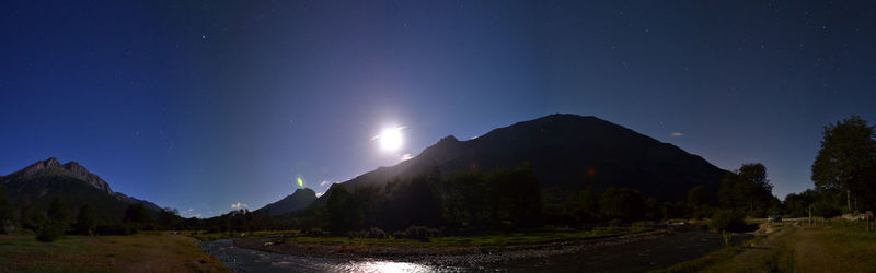 Panoramic view of mountains against clear sky at night