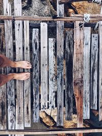 Low section of man on wooden floor