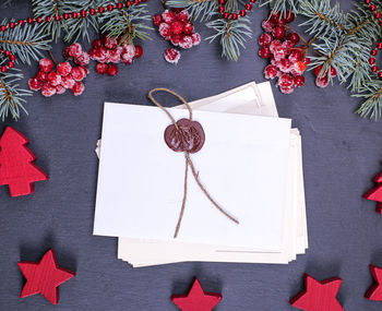 Close-up of christmas decoration with envelopes