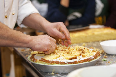 Midsection of man preparing food