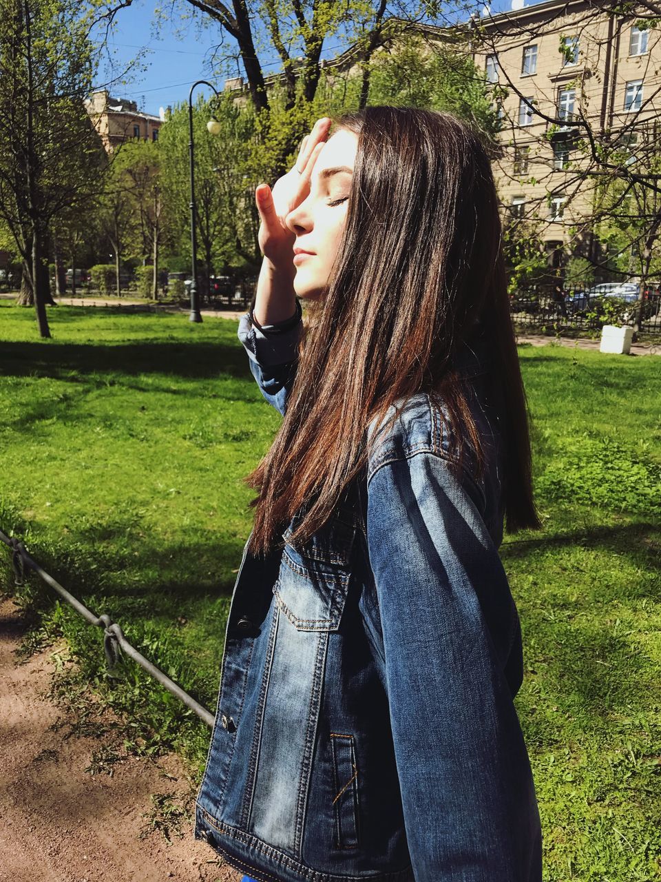 one person, plant, grass, real people, lifestyles, tree, young adult, nature, leisure activity, hair, long hair, young women, day, casual clothing, side view, standing, field, land, hairstyle, outdoors, beautiful woman, teenager, contemplation