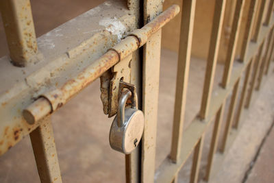 Lock on old vintage iron gate with steel lock stock photo