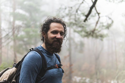 Portrait of bearded hiker smiling at camera
