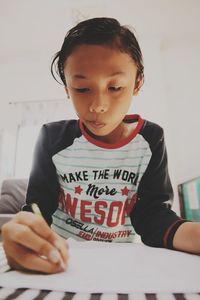 A primary school boy studying at home because of the covid 19 pandemic