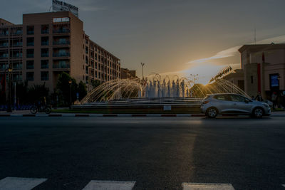 Cars on road against sky
