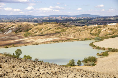 Scenic view of landscape and mountains against sky