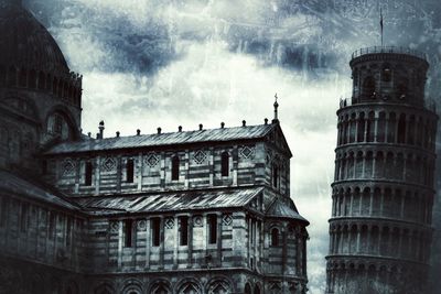 Low angle view of building against cloudy sky