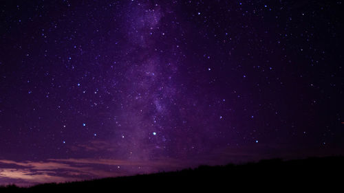 Low angle view of stars in sky at night