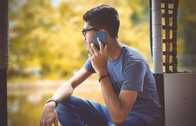 Young man talking on mobile phone