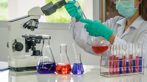 Close-up of scientist examining chemical in laboratory