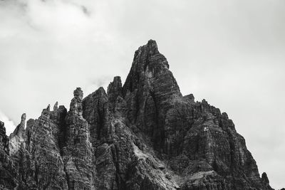 Low angle view of rock formation against sky