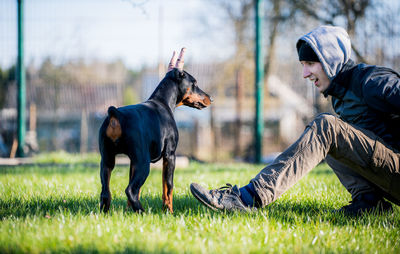 Side view of a dog on field