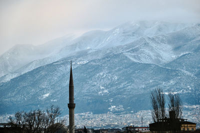 Scenic view of snowcapped mountains against sky