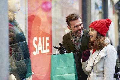 Happy couple kissing in store