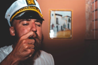Portrait of a man wearing captains hat