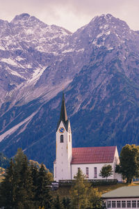 High angle view of building and mountains against sky