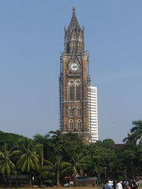 Clock tower of building against sky