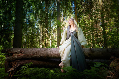 Low angle view of statue in forest