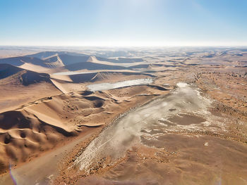 Aerial view of desert against sky