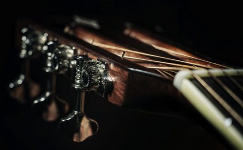Close-up of musical instrument against black background