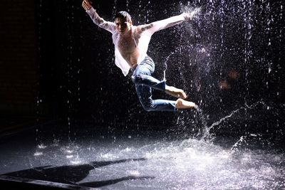 Man jumping in swimming pool